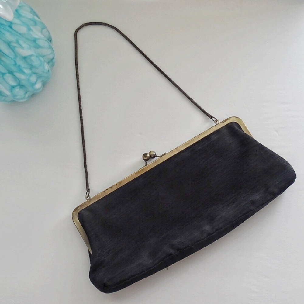 Vintage black clutch purse, gold shoulder strap.